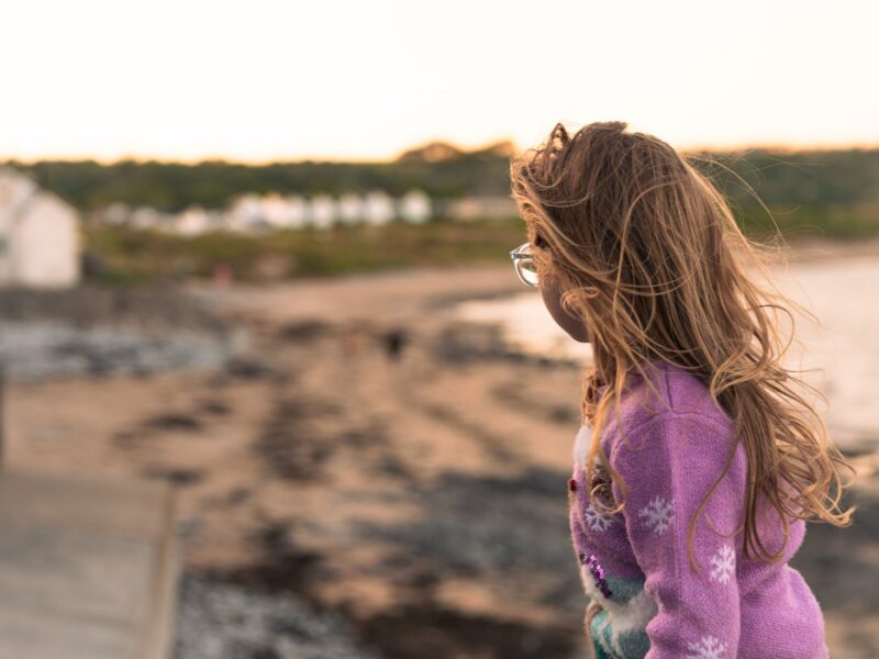 A child enjoying Port Eynon beach